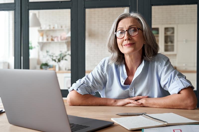 Woman seated with laptop